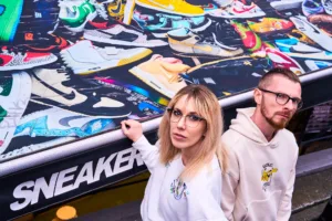 Exploring Harajuku Sneaker Culture on a Tokyo Photo Tour Two people admiring colorful sneakers at a Harajuku sneaker store during a Tokyo photo tour.