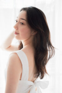 Elegant Woman Portrait for the Tokyo Brand Vivat Veritas Portrait of a woman in a white dress with a bow, natural light photography by JG Brasseur in Tokyo studio.