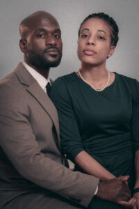 Retro Couple Photography A couple in formal attire, with the man in a suit and the woman in a dress, posing closely together.