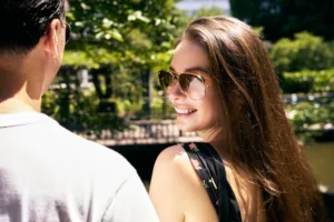 Stylish Aviator Sunglasses in Natural Light – Lifestyle Portrait Test Shot Woman wearing aviator sunglasses in a sunny park, lifestyle portrait test shot for brands.