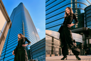 Tokyo Street Fashion: Outdoor Photoshoot with Urban Vibes Two models striking confident poses in black outfits during an outdoor fashion photoshoot in Tokyo, showcasing urban street style and modern architecture.