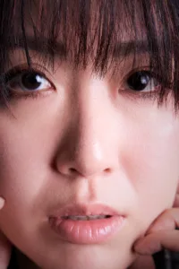 A close-up portrait of Kendy Suen, a singer and artist from Hong Kong.