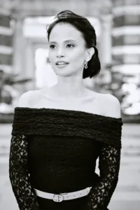 Elegant woman in off-shoulder lace top, black and white fashion portrait by JG Brasseur in Tokyo.