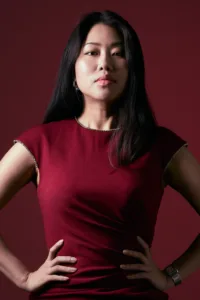 Professional fashion portrait of a woman in a red top, studio photography by JG Brasseur in Tokyo.