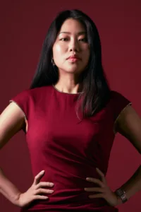 Bold Professional Portrait Photography Colorful portrait with high contrast of a woman in a red burgundy dress by Tokyo freelance photographer JG Brasseur.